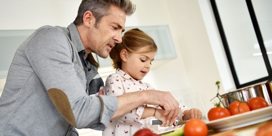 Dad and kid preparing food
